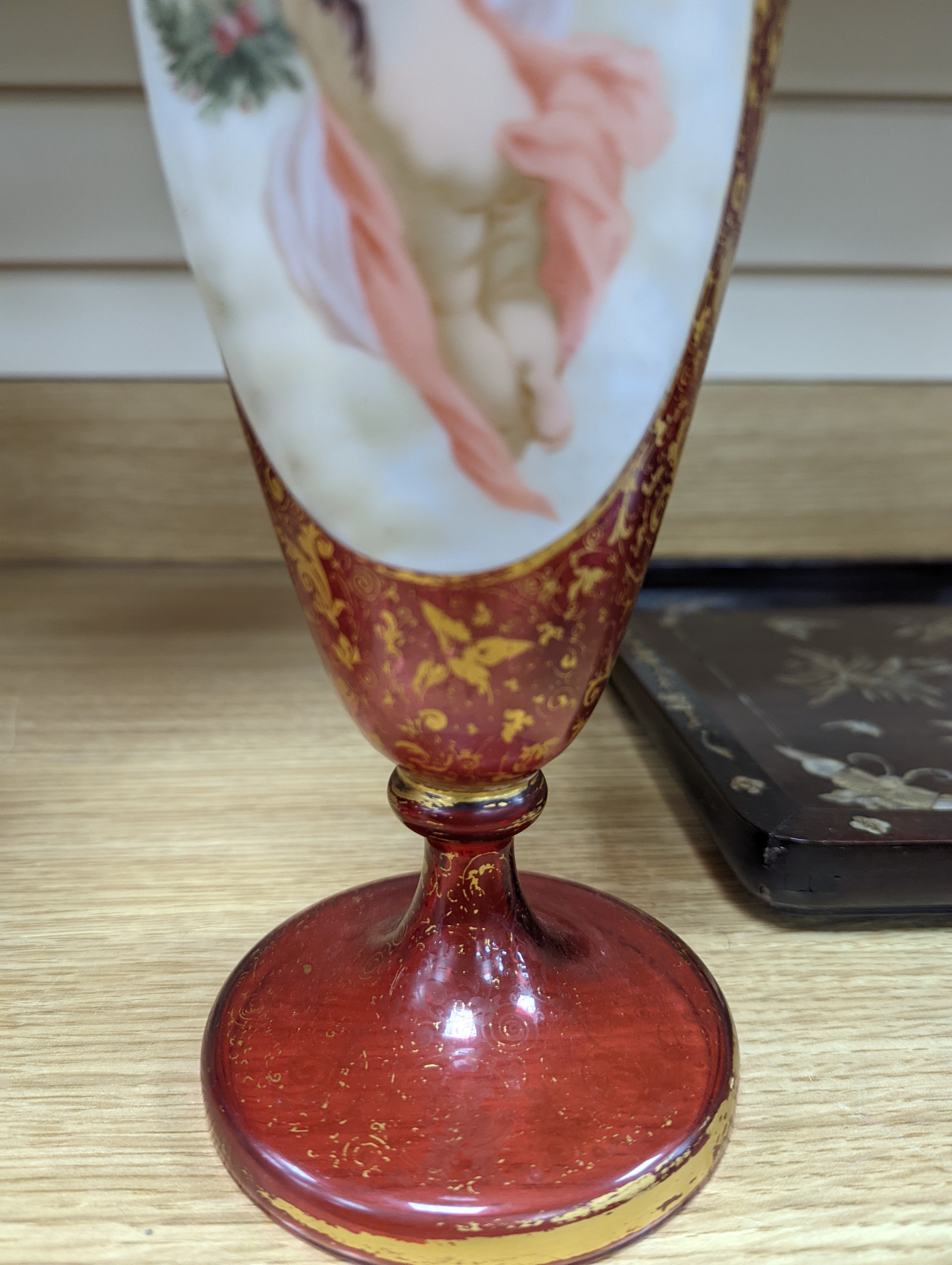 A pair of 19th century Bohemian enamelled and overlaid ruby glass vases 36cm